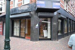 Rookontwikkeling in plafond van winkel in Alkmaar