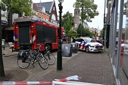 Rookontwikkeling in plafond van winkel in Alkmaar