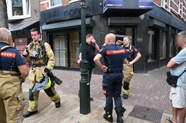 Rookontwikkeling in plafond van winkel in Alkmaar